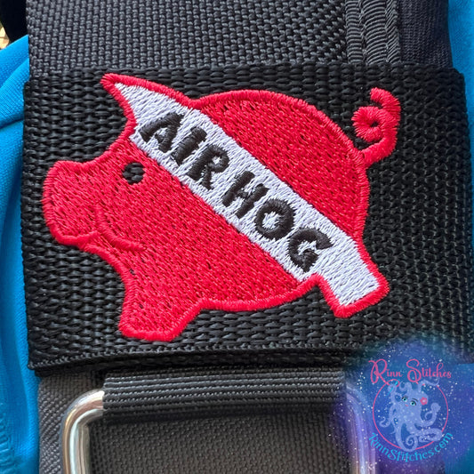 Embroidered BCD Tag with a red and white air hog Design on Black Webbing. Made for scuba divers by Rinn Stitches in Maui, Hawaii