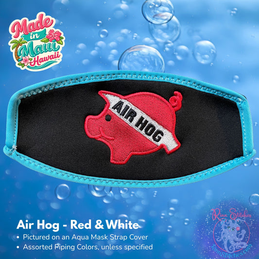 An aqua mask strap cover featuring a red and white embroidered 'AIR HOG' pig design, shown against a blue water-themed background with bubbles. The brand 'Rinn Stitches' is visible in the bottom right corner. Made in Maui, Hawaii