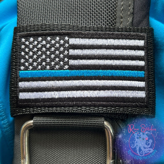 Embroidered BCD Tag with featuring the American Flag Thin Blue Line on Black Webbing. Made for scuba divers by Rinn Stitches in Maui, Hawaii