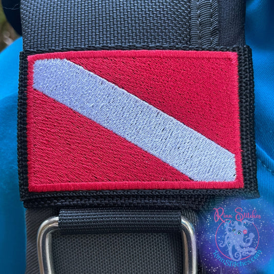 Embroidered BCD Tag with a Red & White iconic Dive Flag Design on Black Webbing. Made for scuba divers by Rinn Stitches in Maui, Hawaii
