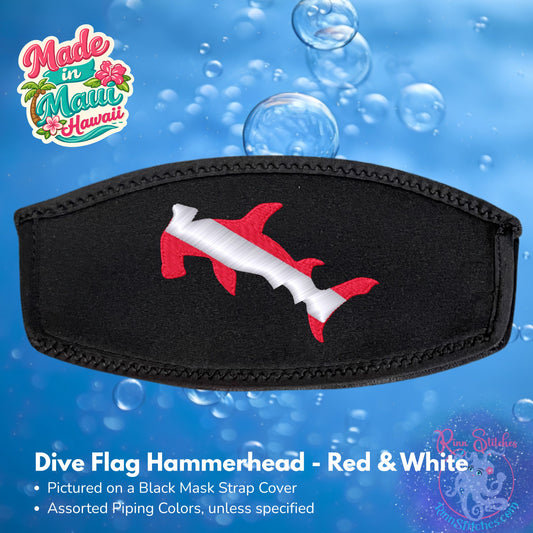 A black neoprene mask strap cover featuring an embroidered red and white hammerhead shark design, shown against a blue water-themed background with bubbles. Made by Rinn Stitches in Maui, Hawaii