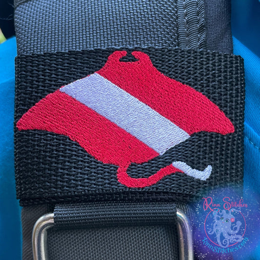Embroidered BCD Tag with a Red & White Dive Flag in the shape of a manta ray silhouette on Black Webbing. Made for scuba divers by Rinn Stitches in Maui, Hawaii