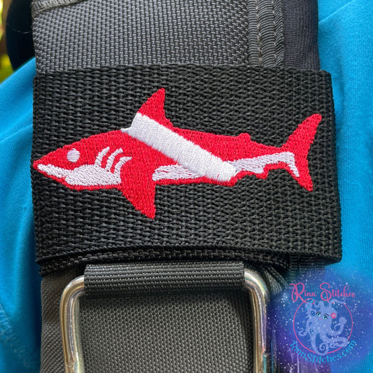 Embroidered BCD Tag with a Red and White Dive Flag Shark Design on Black Webbing. Made for scuba divers by Rinn Stitches in Maui, Hawaii