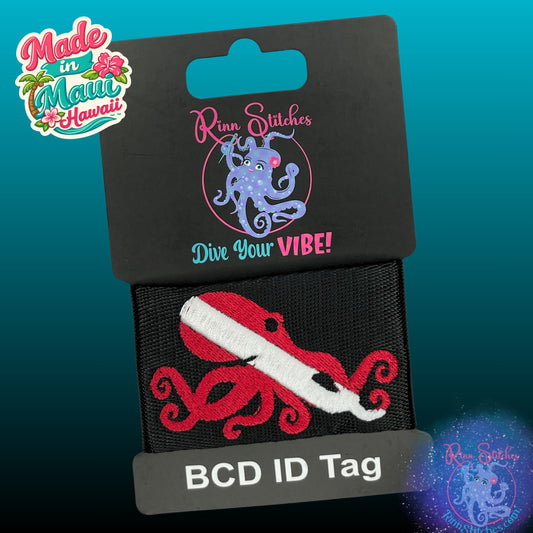 Embroidered BCD Tag with a Dive Flag in the shape of an octopus Design on Black Webbing. Made for scuba divers by Rinn Stitches in Maui, Hawaii