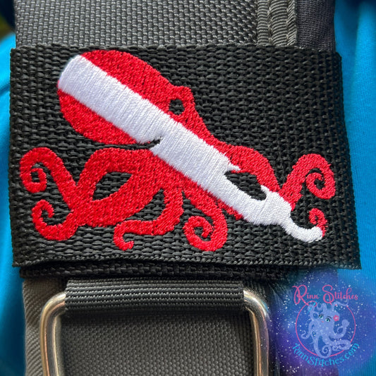 Embroidered BCD Tag with a Dive Flag in the shape of an octopus Design on Black Webbing. Made for scuba divers by Rinn Stitches in Maui, Hawaii