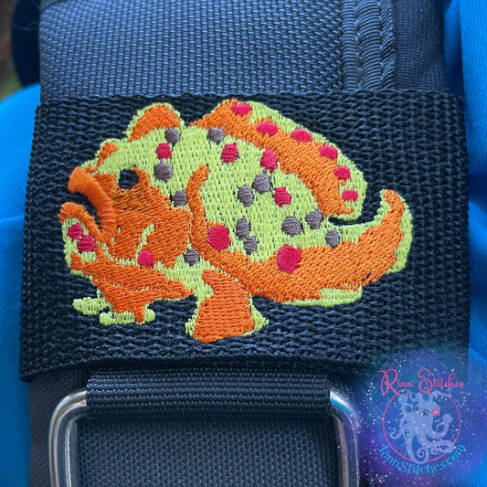 Embroidered BCD Tag featuring a bold frogfish design showcasing its distinctive shape and texture on Black Webbing. Made for scuba divers by Rinn Stitches in Maui, Hawaii