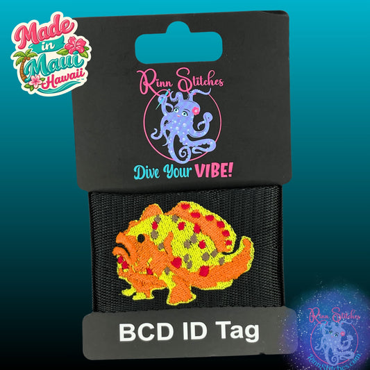 Embroidered BCD Tag featuring a bold frogfish design showcasing its distinctive shape and texture on Black Webbing. Made for scuba divers by Rinn Stitches in Maui, Hawaii