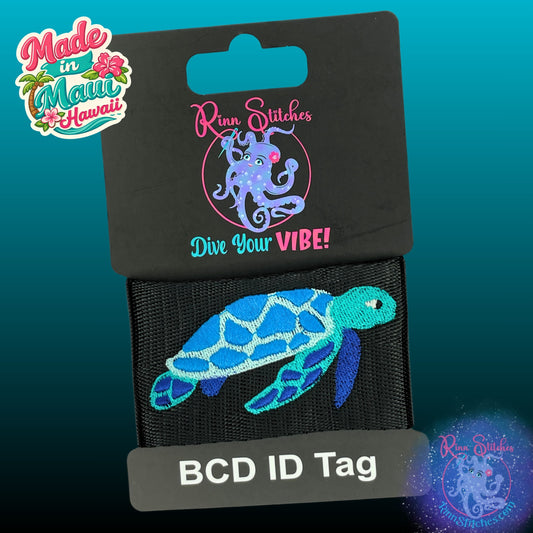 Embroidered BCD Tag featuring a Sea Turtle in Teal and Blues on Black Webbing. Made for scuba divers by Rinn Stitches in Maui, Hawaii