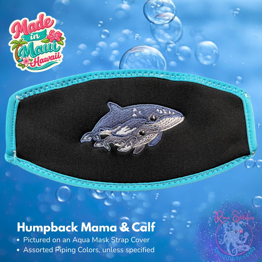 Embroidered mask strap cover featuring a humpback whale mama and calf design. Made by Rinn Stitches on Maui, Hawaii