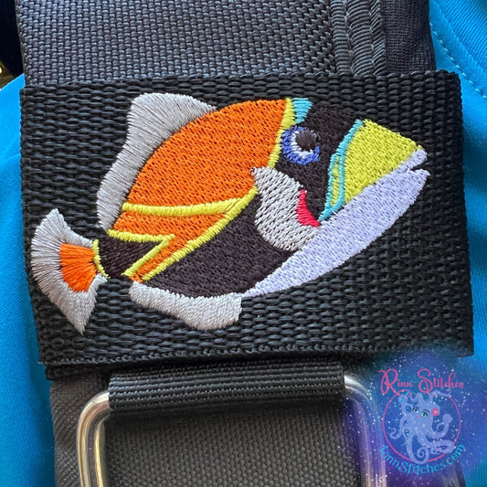 Embroidered BCD Tag Featuring the Humuhumunukunukuapua'a Reef Triggerfish, Hawaii’s state fish, brought to life in a bold, colorful design on Black Webbing. Made for scuba divers by Rinn Stitches in Maui, Hawaii