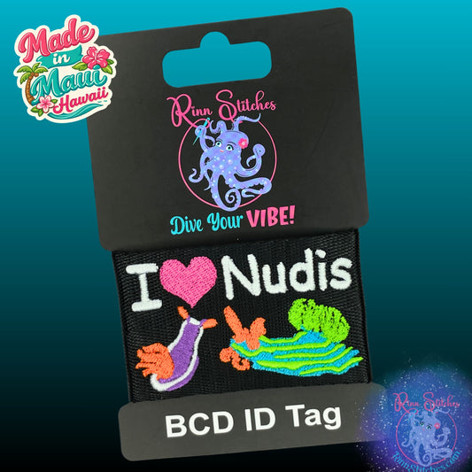 Embroidered BCD Tag Featuring a playful ‘I Heart Nudis’ design for true nudibranch lovers on Black Webbing. Made for scuba divers by Rinn Stitches in Maui, Hawaii