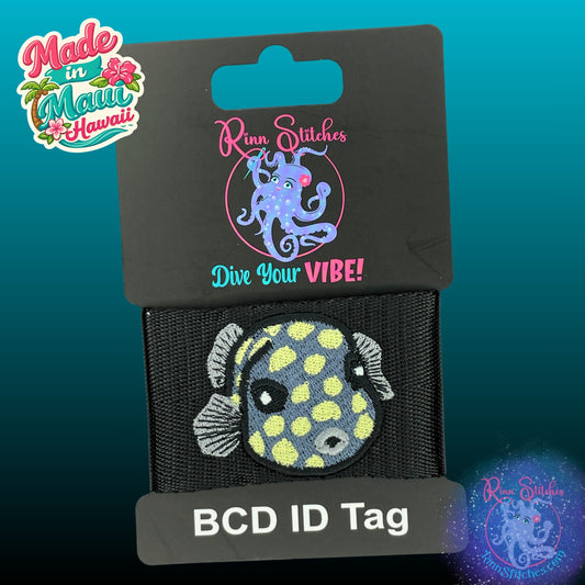Embroidered BCD Tag Featuring a juvenile smooth trunkfish with its signature boxy shape and playful ocean vibe on Black Webbing. Made for scuba divers by Rinn Stitches in Maui, Hawaii