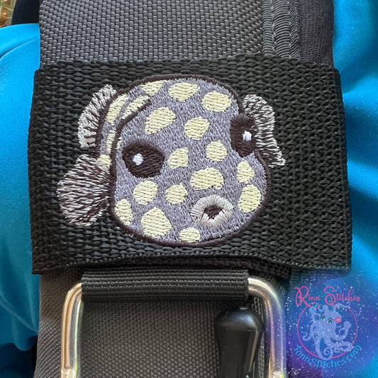 Embroidered BCD Tag Featuring a juvenile smooth trunkfish with its signature boxy shape and playful ocean vibe on Black Webbing. Made for scuba divers by Rinn Stitches in Maui, Hawaii