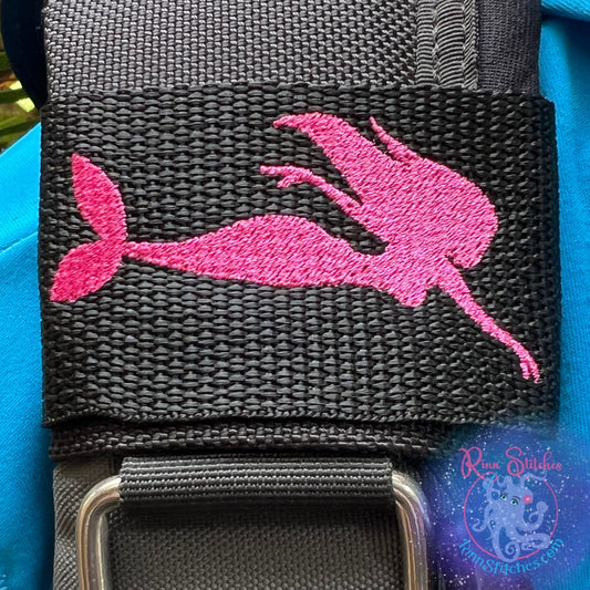 Embroidered BCD Tag with a mermaid silhouette in fuchsia thread on Black Webbing. Made for scuba divers by Rinn Stitches in Maui, Hawaii