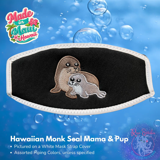 Embroidered mask strap cover featuring a Hawaiian monk seal mama and pup. Made by Rinn Stitches on Maui, Hawaii