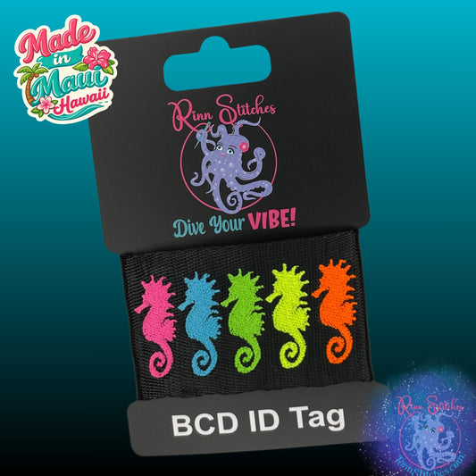 Embroidered BCD Tag Featuring a vibrant lineup of five neon-colored seahorses that pop on your gear on Black Webbing. Made for scuba divers by Rinn Stitches in Maui, Hawaii