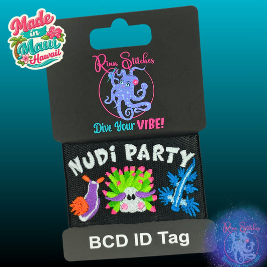 Embroidered BCD Tag Featuring brightly colored nudibranchs with ‘Nudi Party’ text, bringing a fun and lively reef vibe on Black Webbing. Made for scuba divers by Rinn Stitches in Maui, Hawaii