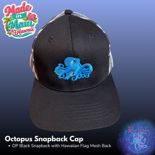 A black snapback cap with a blue embroidered octopus on the front, shown against a blue gradient background. The cap has a black front panel, a blue octopus embroidery, and a Hawaiian flag mesh back. Made by Rinn Stitches in Maui, Hawaii