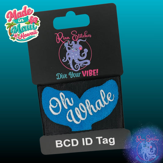 Embroidered BCD tag - Gear tag - Featuring an ocean colored whale tail and the text Oh Whale embroidered across it in white thread. Made in Maui, Hawaii by Rinn Stitches