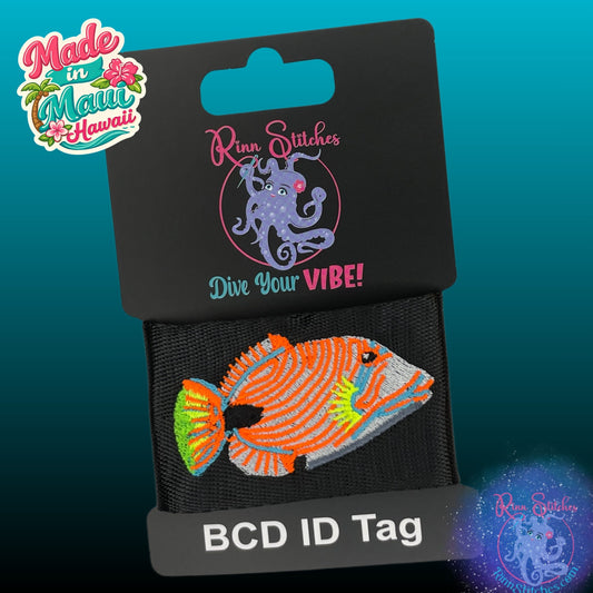 embroidered bcd tag featuring an bright neon orange line triggerfish. Made by Rinn Stitches in Maui, Hawaii
