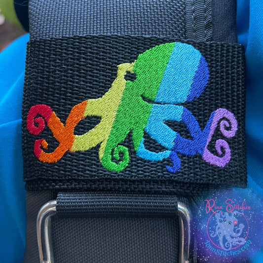 Embroidered BCD Tag Featuring a fun rainbow octopus design that celebrates Pride and self-expression. on Black Webbing. Made for scuba divers by Rinn Stitches in Maui, Hawaii
