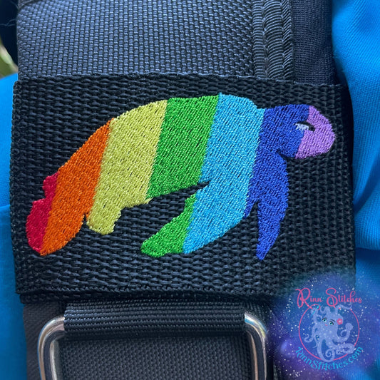 Embroidered BCD Tag Featuring a rainbow sea turtle design that celebrates Pride and self-expression. on Black Webbing. Made for scuba divers by Rinn Stitches in Maui, Hawaii