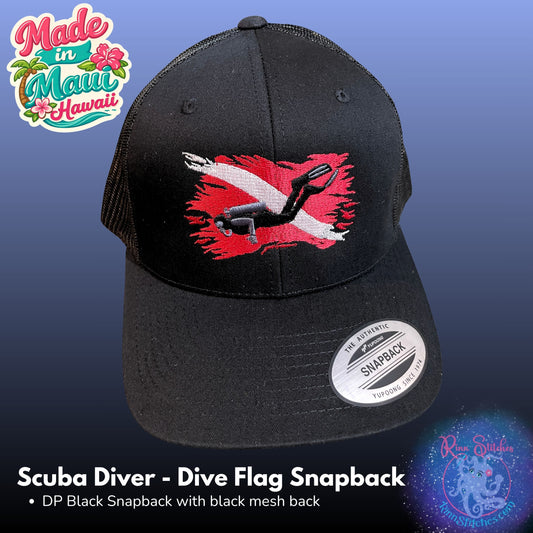 Black snapback cap with a Scuba Diver flag embroidered on the front, featuring a black mesh back and a white Snapback sticker on the brim, set against a blue gradient background. Made in Maui, Hawaii by Rinn Stitches.
