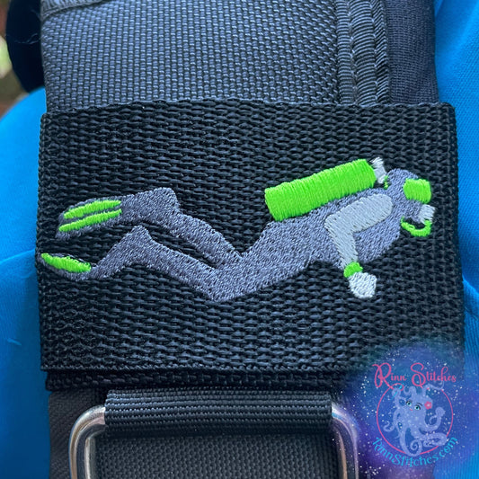 Embroidered BCD Tag with a scuba diver with neon green accent colors on Black Webbing. Made for scuba divers by Rinn Stitches in Maui, Hawaii