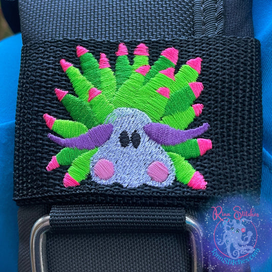 Embroidered BCD Tag Featuring a bold sheep nudibranch design with bright, neon colors that pop on your gear. Design on Black Webbing. Made for scuba divers by Rinn Stitches in Maui, Hawaii