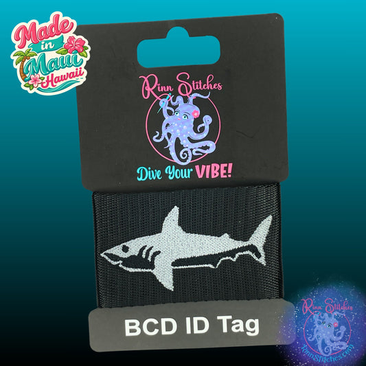 Embroidered BCD Tag featuring a dark shark Design on Black Webbing. Made for scuba divers by Rinn Stitches in Maui, Hawaii
